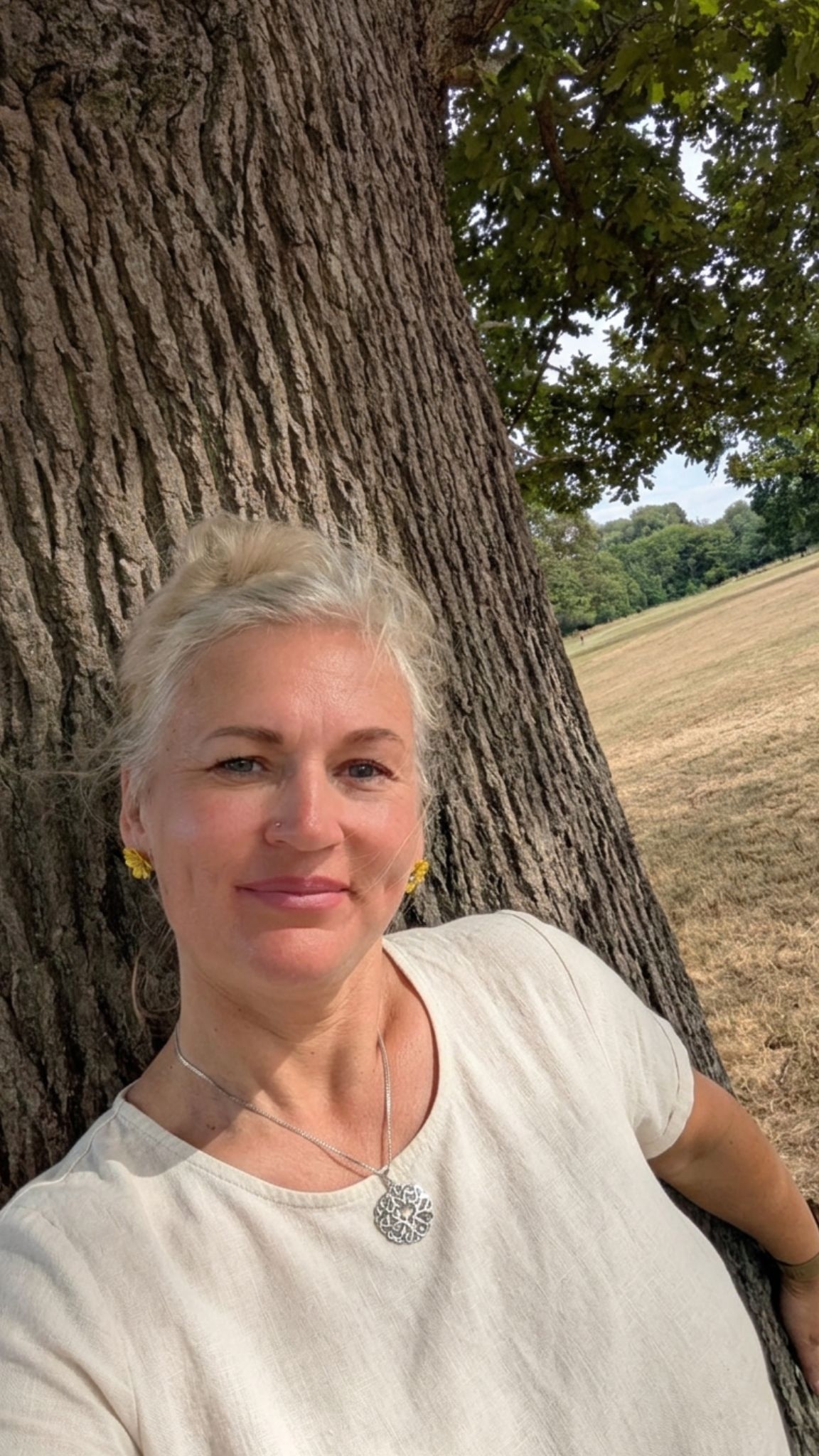 Vaida V. Stone with the Money Tree, the Always ENOUGH™ Method's grounding metaphor