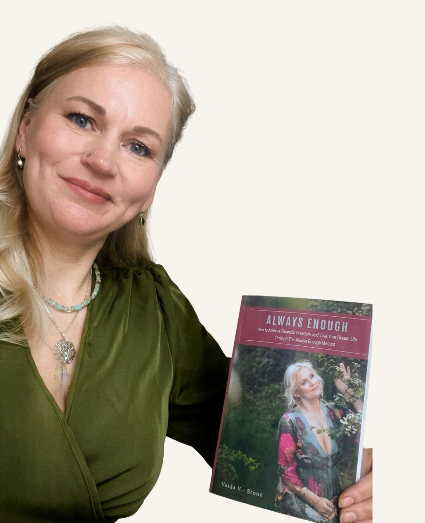 Vaida V. Stone holding a physical copy of her book, Always Enough, cover visible.